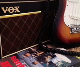 Guitar, practice amp and lessons book
